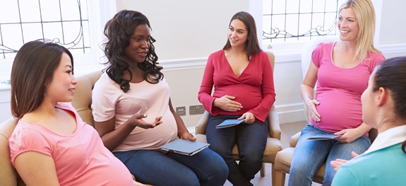 pregnant women speaking in a group
